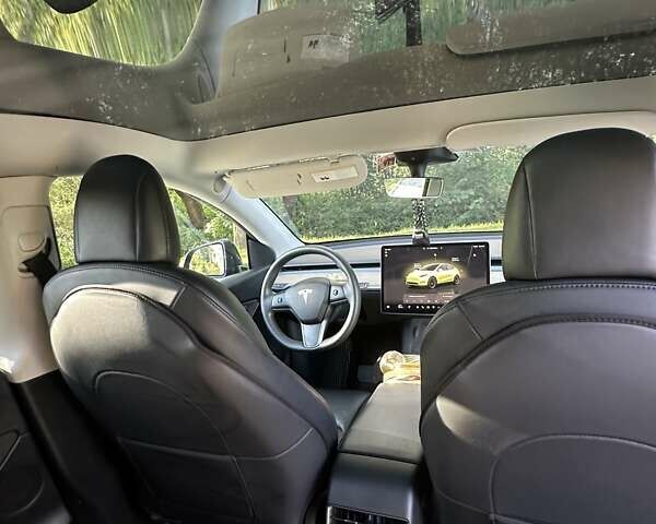 Серый Тесла Model Y, объемом двигателя 0 л и пробегом 60 тыс. км за 28999 $, фото 6 на Automoto.ua