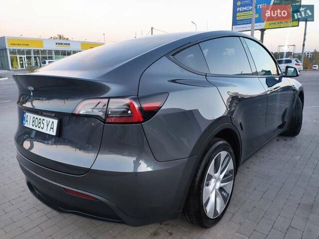 Серый Тесла Model Y, объемом двигателя 0 л и пробегом 74 тыс. км за 26999 $, фото 7 на Automoto.ua