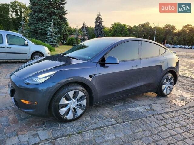 Серый Тесла Model Y, объемом двигателя 0 л и пробегом 49 тыс. км за 26950 $, фото 3 на Automoto.ua