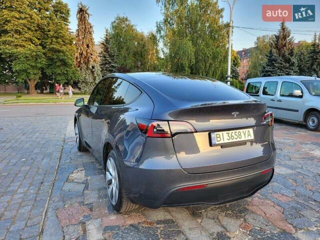 Серый Тесла Model Y, объемом двигателя 0 л и пробегом 49 тыс. км за 26950 $, фото 2 на Automoto.ua