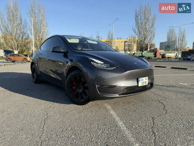 Серый Тесла Model Y, объемом двигателя 0 л и пробегом 99 тыс. км за 24999 $, фото 1 на Automoto.ua