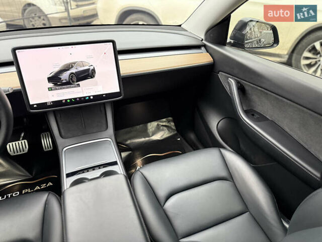 Серый Тесла Model Y, объемом двигателя 0 л и пробегом 53 тыс. км за 28000 $, фото 48 на Automoto.ua