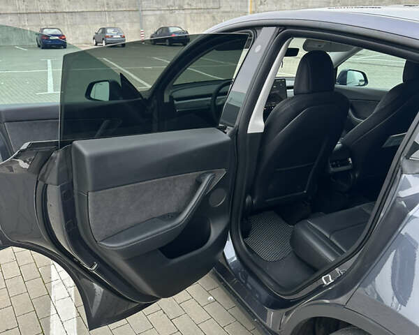 Серый Тесла Model Y, объемом двигателя 0 л и пробегом 58 тыс. км за 28500 $, фото 32 на Automoto.ua