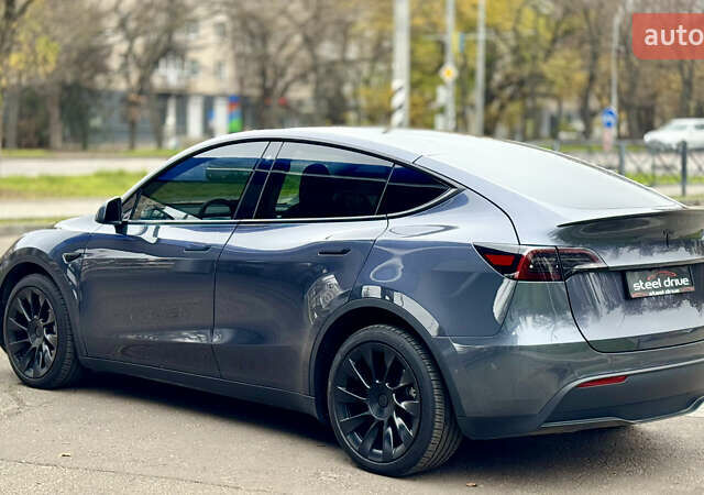 Серый Тесла Model Y, объемом двигателя 0 л и пробегом 130 тыс. км за 25999 $, фото 5 на Automoto.ua