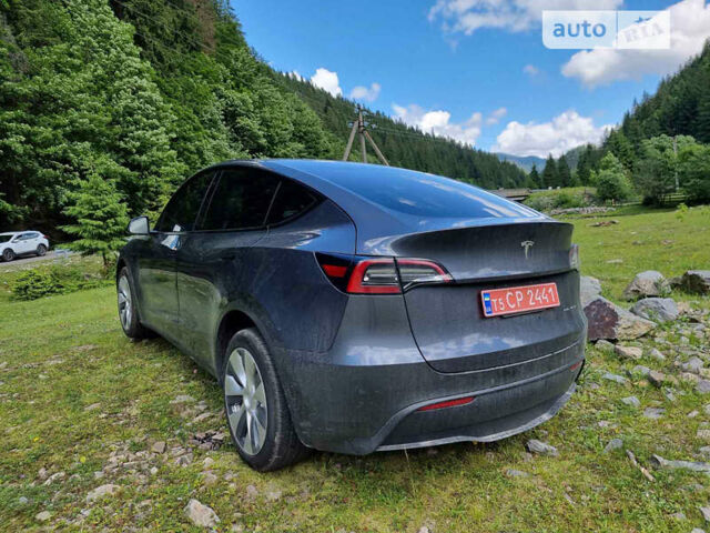 Серый Тесла Model Y, объемом двигателя 0 л и пробегом 13 тыс. км за 29999 $, фото 2 на Automoto.ua