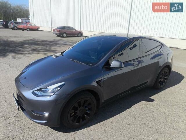 Серый Тесла Model Y, объемом двигателя 0 л и пробегом 77 тыс. км за 30999 $, фото 11 на Automoto.ua