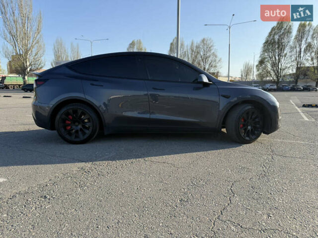 Серый Тесла Model Y, объемом двигателя 0 л и пробегом 99 тыс. км за 24999 $, фото 2 на Automoto.ua