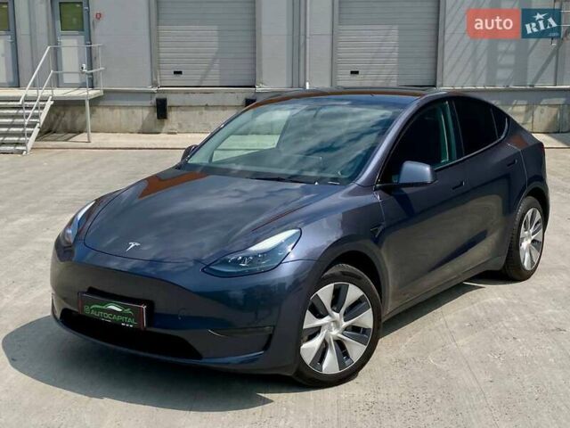 Серый Тесла Model Y, объемом двигателя 0 л и пробегом 20 тыс. км за 33990 $, фото 1 на Automoto.ua