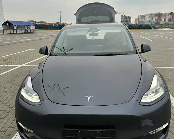 Серый Тесла Model Y, объемом двигателя 0 л и пробегом 58 тыс. км за 28500 $, фото 1 на Automoto.ua