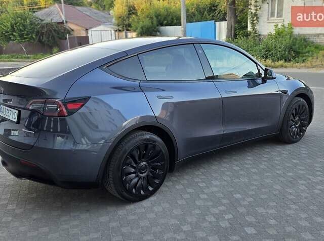 Серый Тесла Model Y, объемом двигателя 0 л и пробегом 77 тыс. км за 25499 $, фото 4 на Automoto.ua
