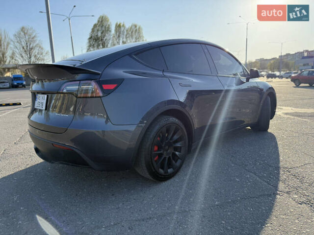 Серый Тесла Model Y, объемом двигателя 0 л и пробегом 99 тыс. км за 24999 $, фото 3 на Automoto.ua