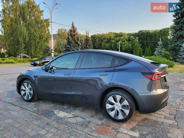 Серый Тесла Model Y, объемом двигателя 0 л и пробегом 49 тыс. км за 26950 $, фото 1 на Automoto.ua