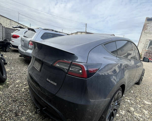 Серый Тесла Model Y, объемом двигателя 0 л и пробегом 99 тыс. км за 19600 $, фото 2 на Automoto.ua