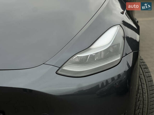 Серый Тесла Model Y, объемом двигателя 0 л и пробегом 52 тыс. км за 27499 $, фото 6 на Automoto.ua