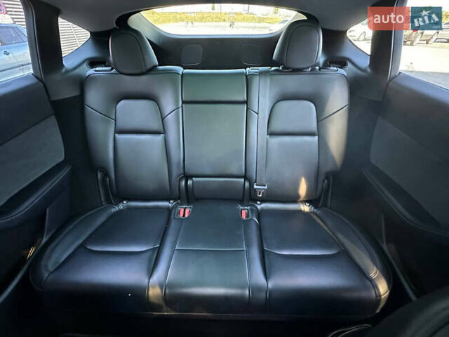 Серый Тесла Model Y, объемом двигателя 0 л и пробегом 93 тыс. км за 27900 $, фото 15 на Automoto.ua
