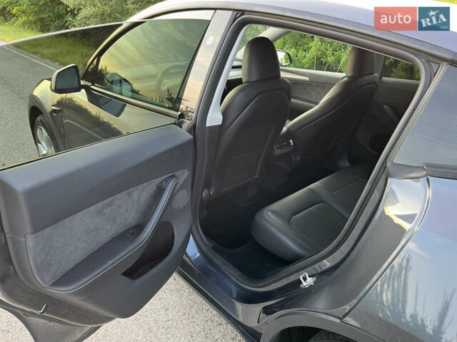 Серый Тесла Model Y, объемом двигателя 0 л и пробегом 27 тыс. км за 28900 $, фото 16 на Automoto.ua