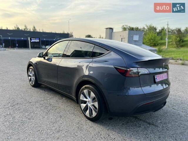Серый Тесла Model Y, объемом двигателя 0 л и пробегом 22 тыс. км за 28999 $, фото 1 на Automoto.ua