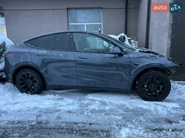 Серый Тесла Model Y, объемом двигателя 0 л и пробегом 26 тыс. км за 18900 $, фото 1 на Automoto.ua