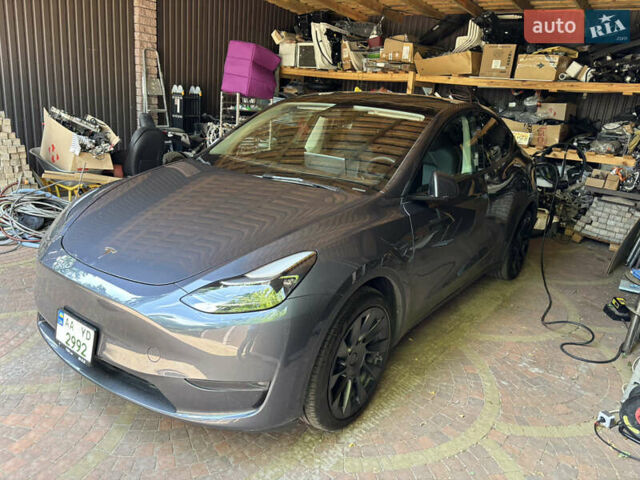 Серый Тесла Model Y, объемом двигателя 0 л и пробегом 32 тыс. км за 33500 $, фото 1 на Automoto.ua