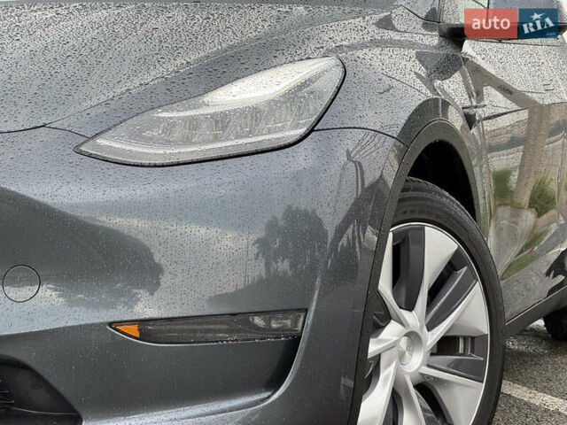 Серый Тесла Model Y, объемом двигателя 0 л и пробегом 66 тыс. км за 27900 $, фото 2 на Automoto.ua