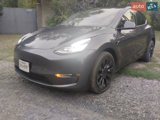 Серый Тесла Model Y, объемом двигателя 0 л и пробегом 25 тыс. км за 28000 $, фото 1 на Automoto.ua