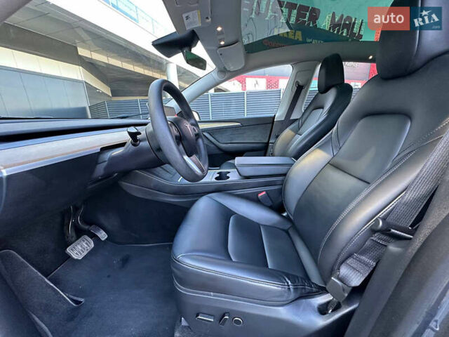 Серый Тесла Model Y, объемом двигателя 0 л и пробегом 93 тыс. км за 27900 $, фото 11 на Automoto.ua