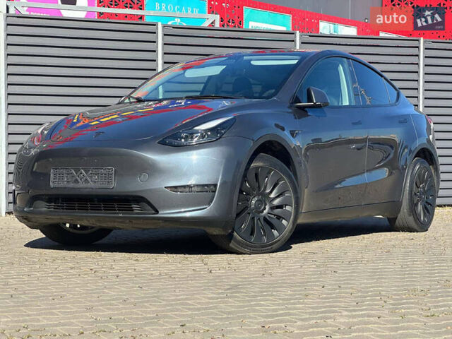 Серый Тесла Model Y, объемом двигателя 0 л и пробегом 93 тыс. км за 27900 $, фото 2 на Automoto.ua