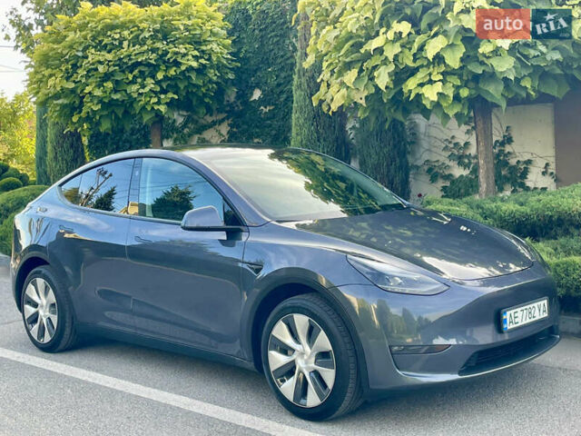 Серый Тесла Model Y, объемом двигателя 0 л и пробегом 21 тыс. км за 25300 $, фото 1 на Automoto.ua