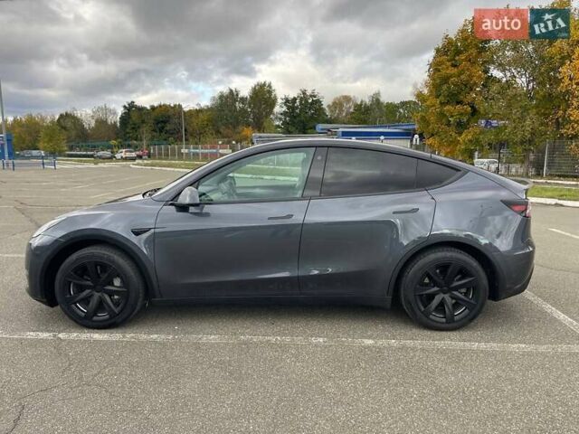 Серый Тесла Model Y, объемом двигателя 0 л и пробегом 51 тыс. км за 28900 $, фото 2 на Automoto.ua