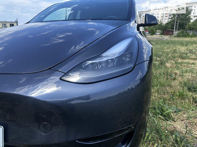 Серый Тесла Model Y, объемом двигателя 0 л и пробегом 31 тыс. км за 26500 $, фото 1 на Automoto.ua