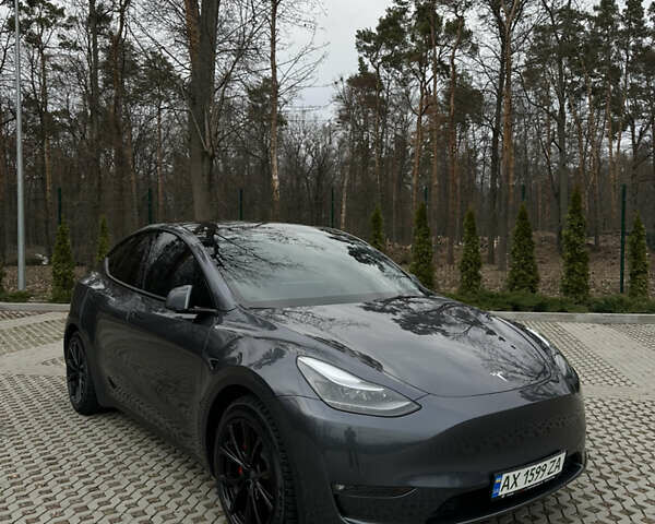 Серый Тесла Model Y, объемом двигателя 0 л и пробегом 22 тыс. км за 32000 $, фото 1 на Automoto.ua