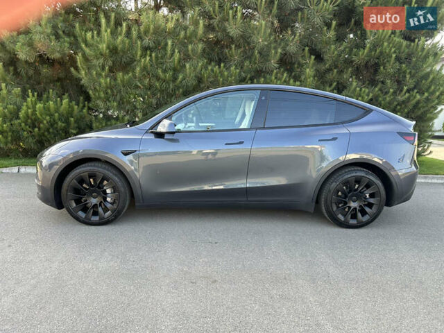 Серый Тесла Model Y, объемом двигателя 0 л и пробегом 55 тыс. км за 29500 $, фото 1 на Automoto.ua