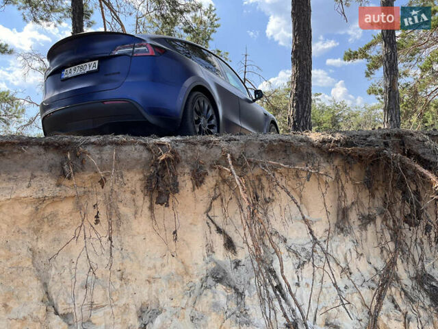 Синий Тесла Model Y, объемом двигателя 0 л и пробегом 75 тыс. км за 25000 $, фото 2 на Automoto.ua