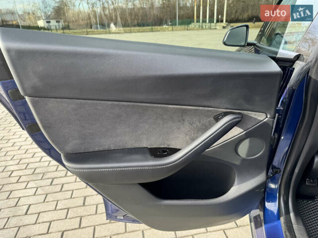 Синий Тесла Model Y, объемом двигателя 0 л и пробегом 83 тыс. км за 23800 $, фото 25 на Automoto.ua