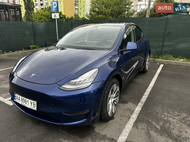 Синій Тесла Model Y, об'ємом двигуна 0 л та пробігом 82 тис. км за 26500 $, фото 1 на Automoto.ua