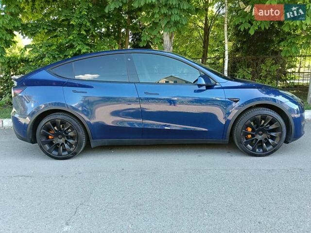 Синий Тесла Model Y, объемом двигателя 0 л и пробегом 65 тыс. км за 25000 $, фото 2 на Automoto.ua