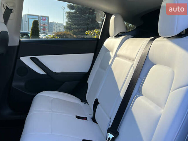 Синій Тесла Model Y, об'ємом двигуна 0 л та пробігом 64 тис. км за 26900 $, фото 18 на Automoto.ua