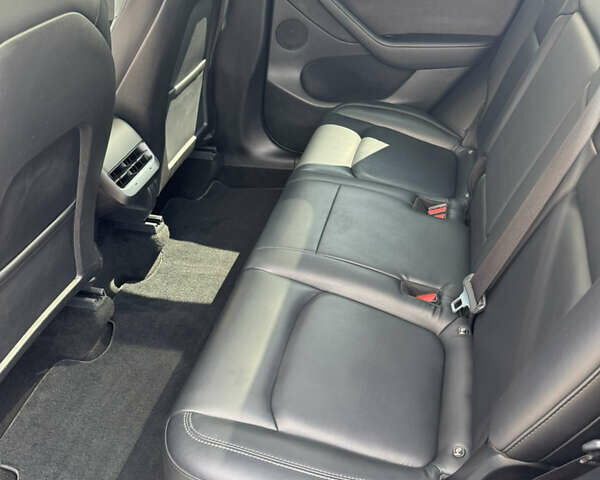 Синий Тесла Model Y, объемом двигателя 0 л и пробегом 83 тыс. км за 24999 $, фото 24 на Automoto.ua