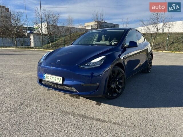 Синий Тесла Model Y, объемом двигателя 0 л и пробегом 125 тыс. км за 20899 $, фото 2 на Automoto.ua