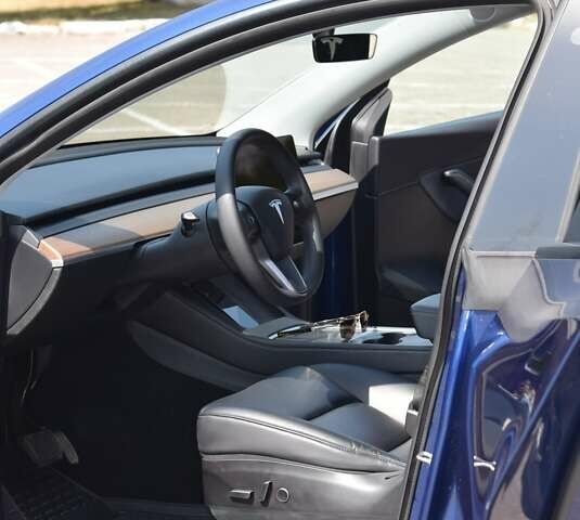 Синий Тесла Model Y, объемом двигателя 0 л и пробегом 81 тыс. км за 25499 $, фото 28 на Automoto.ua