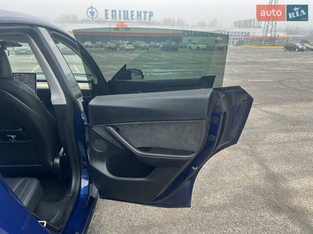 Синий Тесла Model Y, объемом двигателя 0 л и пробегом 125 тыс. км за 25997 $, фото 18 на Automoto.ua