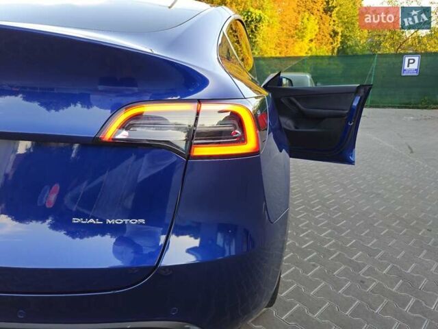 Синий Тесла Model Y, объемом двигателя 0 л и пробегом 99 тыс. км за 25900 $, фото 23 на Automoto.ua