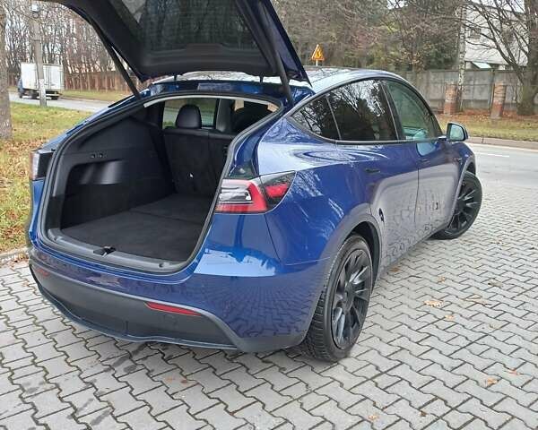 Синий Тесла Model Y, объемом двигателя 0 л и пробегом 91 тыс. км за 25850 $, фото 11 на Automoto.ua