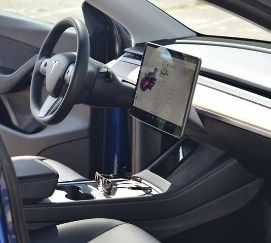 Синий Тесла Model Y, объемом двигателя 0 л и пробегом 81 тыс. км за 25499 $, фото 32 на Automoto.ua