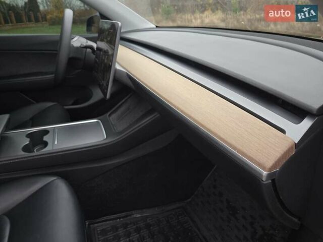 Синий Тесла Model Y, объемом двигателя 0 л и пробегом 99 тыс. км за 25500 $, фото 27 на Automoto.ua