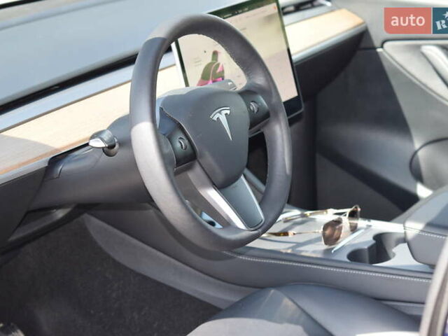 Синий Тесла Model Y, объемом двигателя 0 л и пробегом 81 тыс. км за 25499 $, фото 37 на Automoto.ua