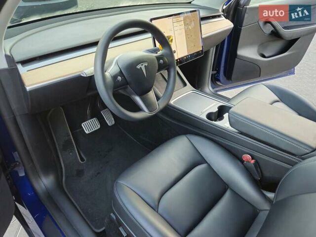 Синий Тесла Model Y, объемом двигателя 0 л и пробегом 99 тыс. км за 26500 $, фото 31 на Automoto.ua