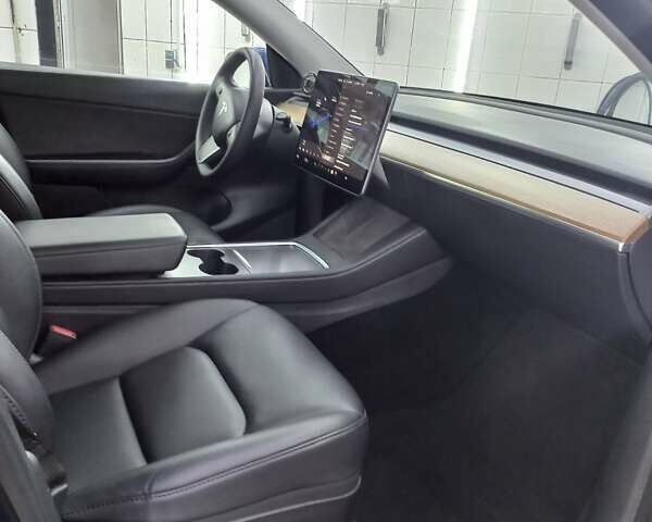 Синий Тесла Model Y, объемом двигателя 0 л и пробегом 91 тыс. км за 25850 $, фото 15 на Automoto.ua