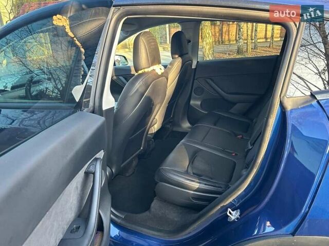 Синий Тесла Model Y, объемом двигателя 0 л и пробегом 62 тыс. км за 25800 $, фото 13 на Automoto.ua
