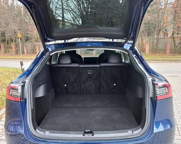 Синий Тесла Model Y, объемом двигателя 0 л и пробегом 91 тыс. км за 25850 $, фото 1 на Automoto.ua